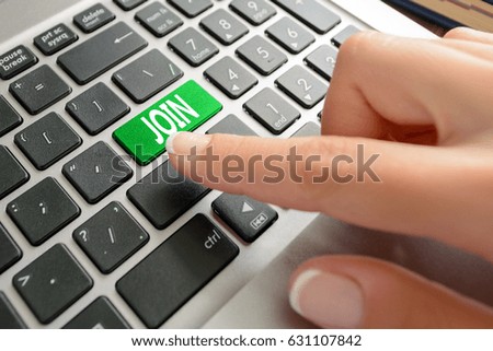 Closed up finger on keyboard with text Join