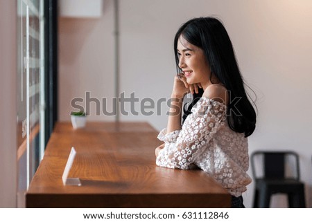 Cute girl sitting in a coffee shop