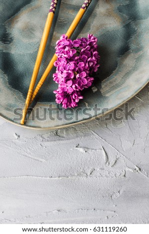 Spring table setting with lilac flowers