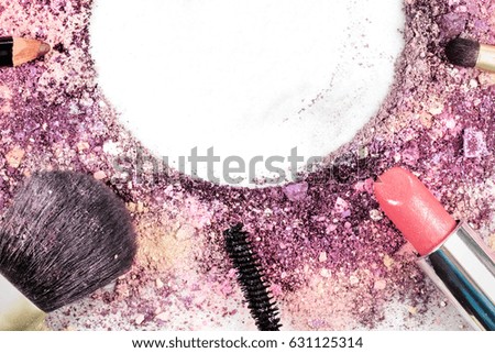 Closeup of makeup brushes, lipstick and pencil on a white background, with traces of powder and blush on it. A horizontal template for a makeup artist's business card or flyer design, with copy space