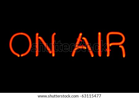 Red neon sign of the words 'On Air' on a black background. Royalty-Free Stock Photo #63115477