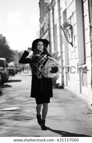 Black and white photo of a young girl on walk