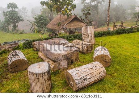 The nature of the cross section of trees. Made of wooden bench and table made of trunks tree is placed on the tourist trail