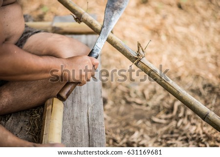 Family son and father making table by bamboo tree together country side outdoor activity