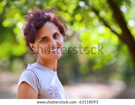 Portrait of a young redhead woman outdoor