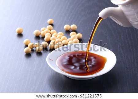 Soy sauce is poured