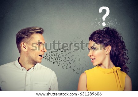 Man talking to an attractive woman with question mark  Royalty-Free Stock Photo #631289606