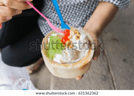 woman holding coconut ice cream