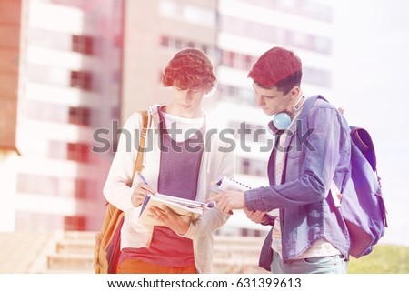 Young male college students studying at campus