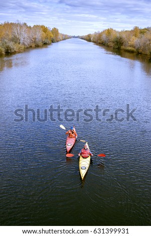 Journey down the river on a sunny day in a canoe.