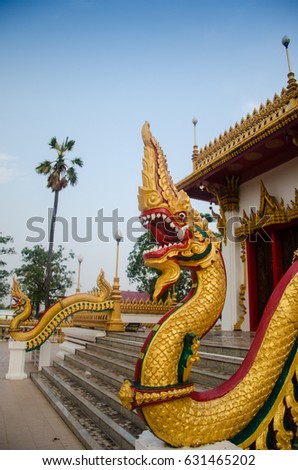 King of naga  in front of the entrance of church, King of snake with blue sky background
