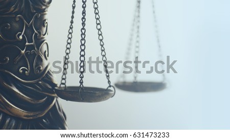          Legal law concept image, abstract close up detail of scales of justice                      Royalty-Free Stock Photo #631473233