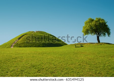 Perfect blue and green landscape, hill and tree, "Kopiec Kraka" in Cracow Royalty-Free Stock Photo #631494125