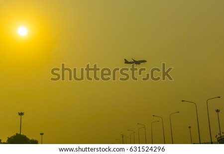 The plane picked up from the airport in the morning at sunrise Silhouette picture.