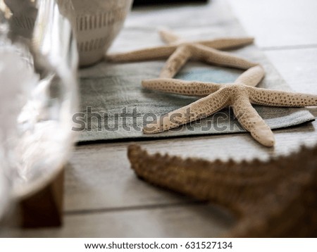 Couple Starfish decorate on the wooden table background.