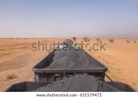 Mauritanian Iron Ore Train with Passengers Royalty-Free Stock Photo #631579472