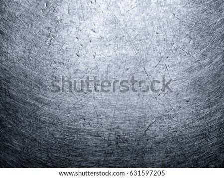 The uneven texture of the rough metal surface.