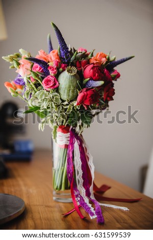 Bright and stylish bouquet of the bride. Wedding floristics and details.