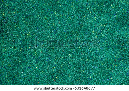 Colored sand background macro photo with grains of sand