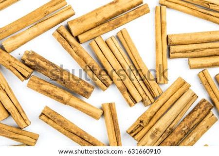 Cinnamon sticks isolated on white background cutout. Top view in focus. Wooden tasty bark spices. Seamless closeup texture material