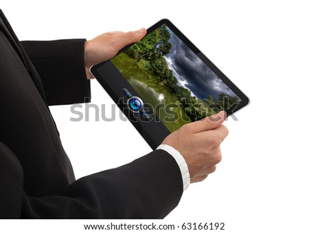 male hand holding a touchpad pc showing a movie, isolated on white