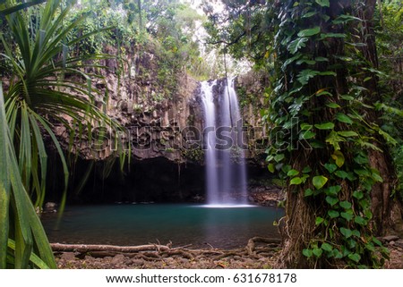 Peaceful long exposure waterfall in tropical jungle