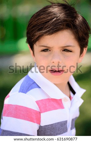 Cute boy portrait with a serious look