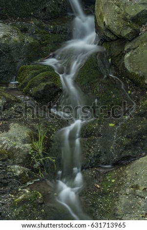 Waterfall near Moravany village in spring green evening