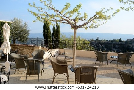 Outdoor patio overlooking panoramic view of valley adjacent to Gordes France