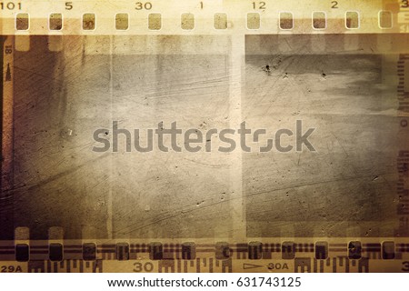Film negative frames on brown background Royalty-Free Stock Photo #631743125
