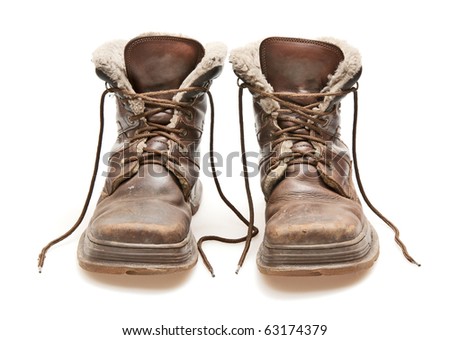 old brown boots isolated on white