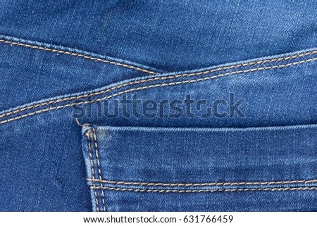 Part of the blue jeans pocket.Horizontal.