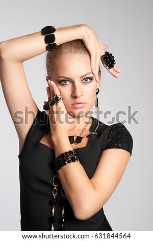 Model in Studio on a gray background with black accessories