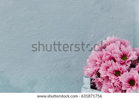 Flowers over wooden background 