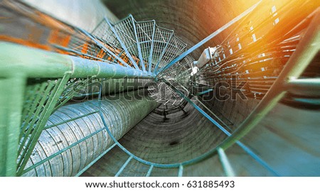 Industrial Factory. Various mechanisms and metal pipes. Toned image. Motion blur effect.
