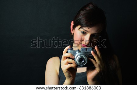 Woman with vintage camera 