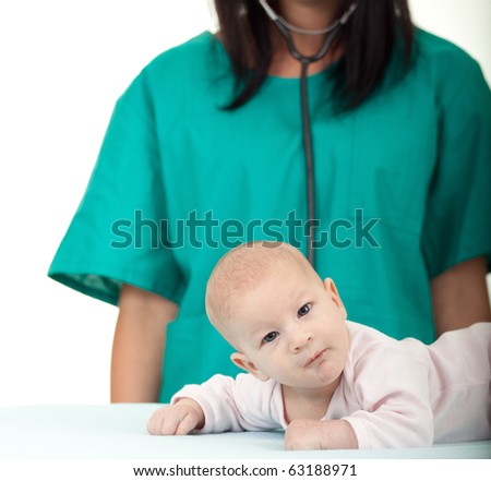 woman doctor with stethoscope exams baby