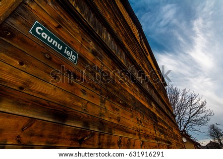 Outside wooden wall of a house with street sign. "Marten Street"