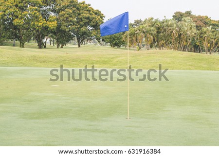 Blue flag at the beautiful golf course of golf course  