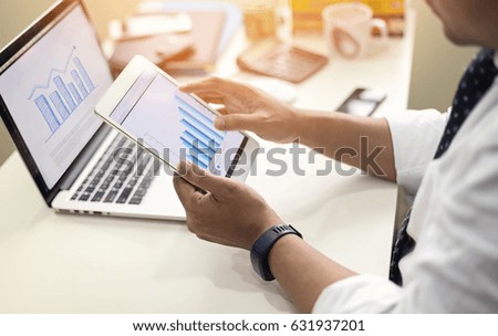 Image of young businessman with tablet computer. Project Management Ideas Development Graph Concept