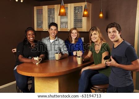 Young Group of Friends at the Cafe