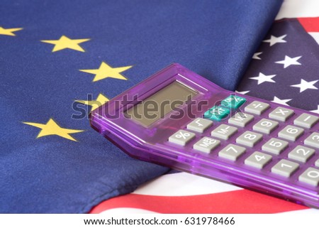 Flags of the EU and the USA and a calculator