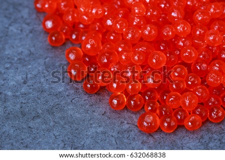 Placer of red caviar on a table