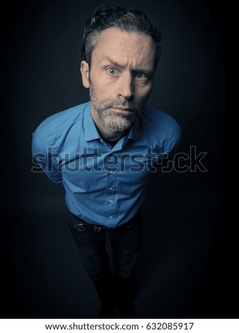 Crazy business man on a dark background