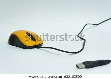 Orange computer mouse on a white background