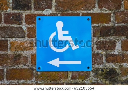 A sign giving directions for Disabled Access.