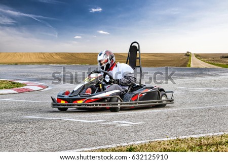 Go Kart Racer on the Track in Nature Royalty-Free Stock Photo #632125910
