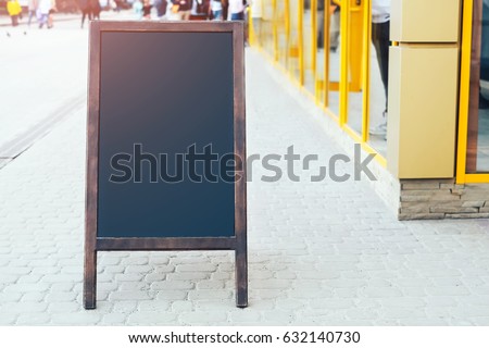 Advertising wooden sign outdoor on the street