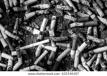 selective focus of  burned cigarette in ashtray,abstract background for no smoking in city and World No Tobacco Day concept.