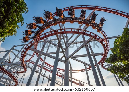 Roller Coaster Track on background of blue sky Royalty-Free Stock Photo #632150657